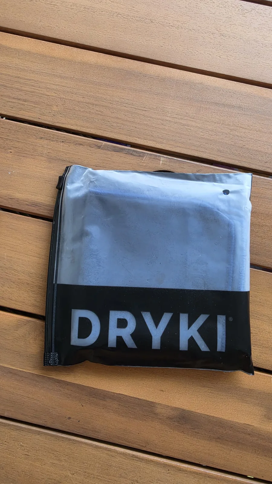 Close crop of the larger towel pouch and black packaging from the road-trip kit.